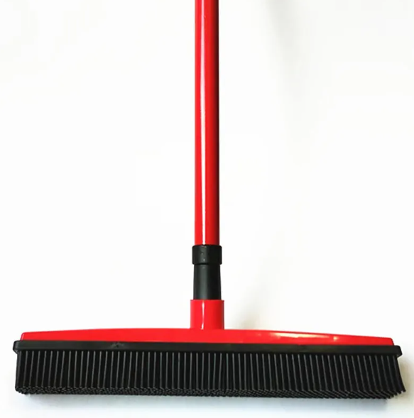dog shedding broom picks up pet hair from tile and carpet
