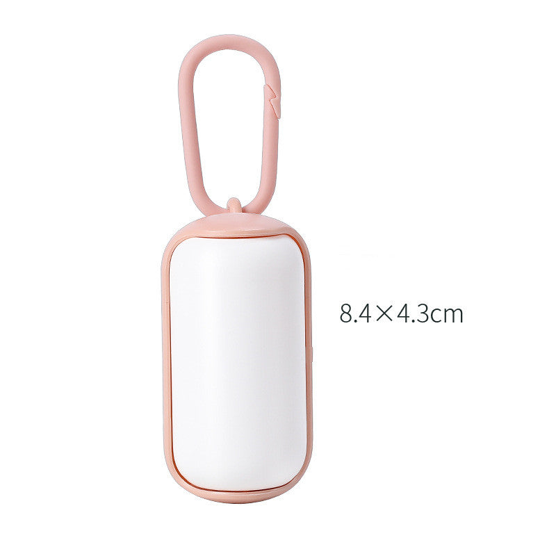 compact dog potty solution for travel and walks pink white
