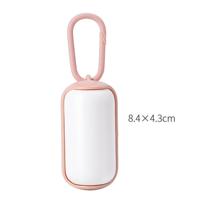 compact dog potty solution for travel and walks pink white